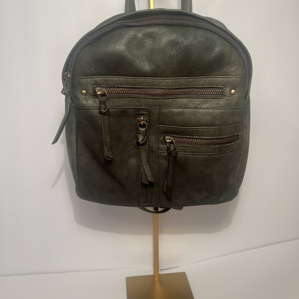 Green Backpack with Rugged Design and Leather Material